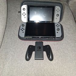 2 Nintendo Switch Game Consoles Hac-001-(01) 32gb W/ Gray Joy- Con,  One Game, Travel Case,  Joy Con Grip, And One 1.5TB SD Card!!!