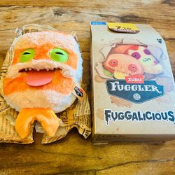 Sushi Fuggler, officially known as Sashimmay, is a quirky 9-inch plush from the Food-Fuggalicious!