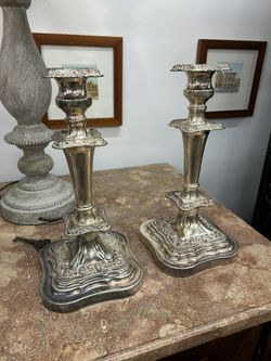 Pair of Silver plated ornate single candlesticks 