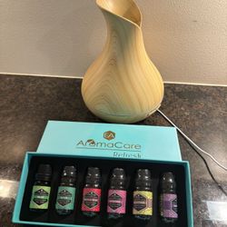 aromatherapy diffuser and a set of essential oils from "AromaCare Refresh"