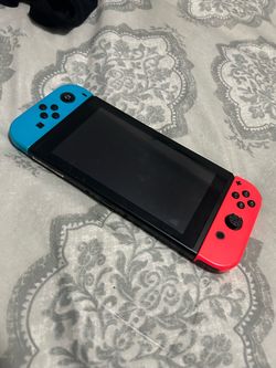 Nintendo Switch with Neon Blue and Red Joy-Cons