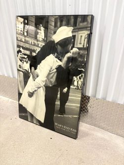 War’s End Kiss photo 1945. framed on glossy finish. 36” x 24” $50