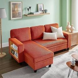 Orange couch with bookshelves, storage, and pullout