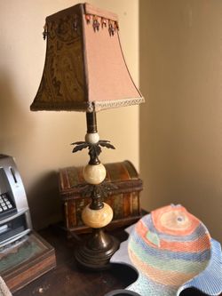 traditional table lamp featuring stacked marble spheres and a patterned fabric shade with beaded trim. Bought in 1992