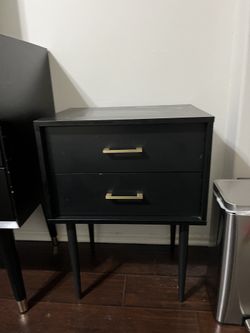 Modern black 2-drawer nightstand with brass hardware
