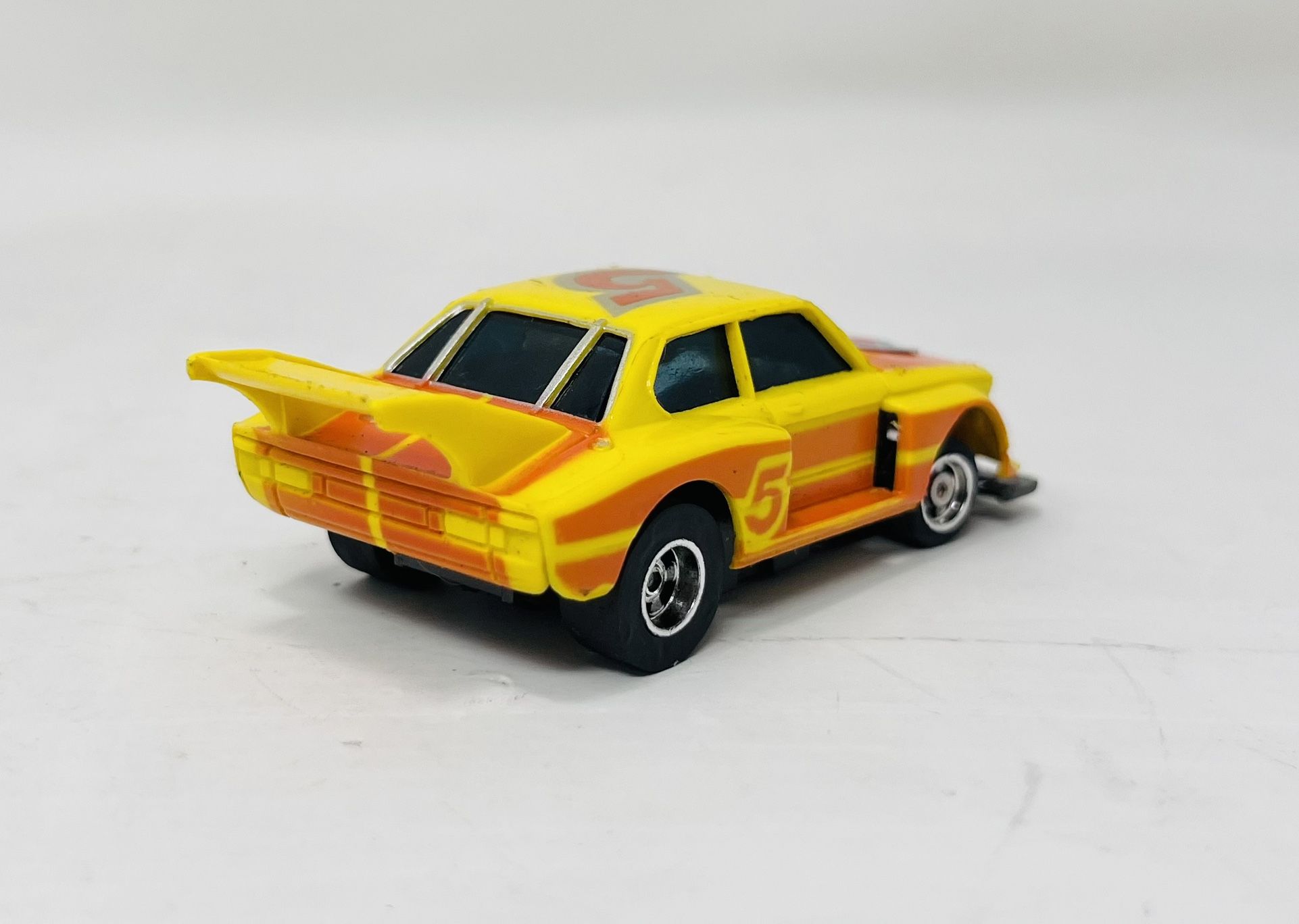Aurora / AFX #5 BMW Turbo Yellow / Orange HO Scale Slot Car for