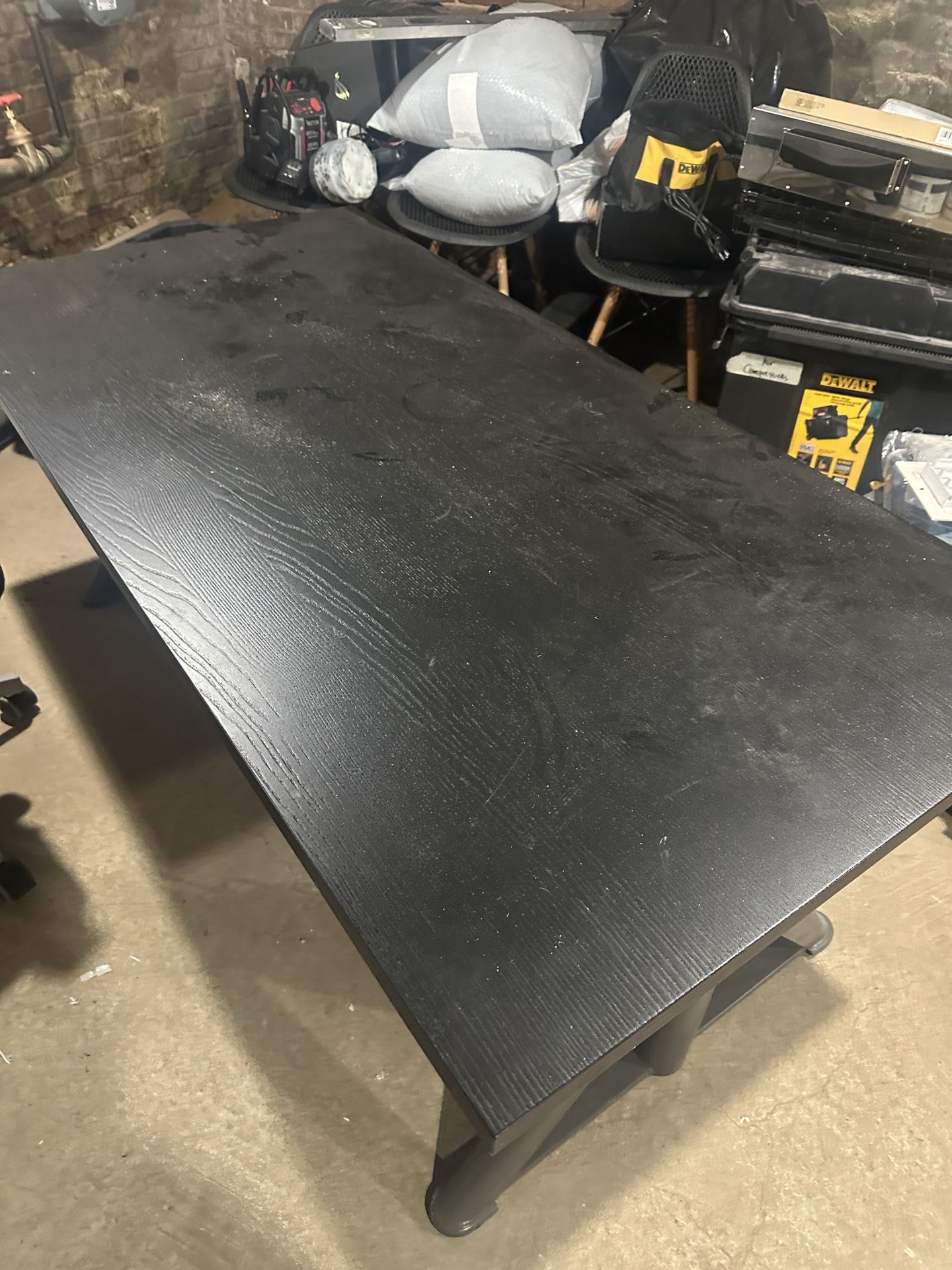Black adjustable desk and office chair