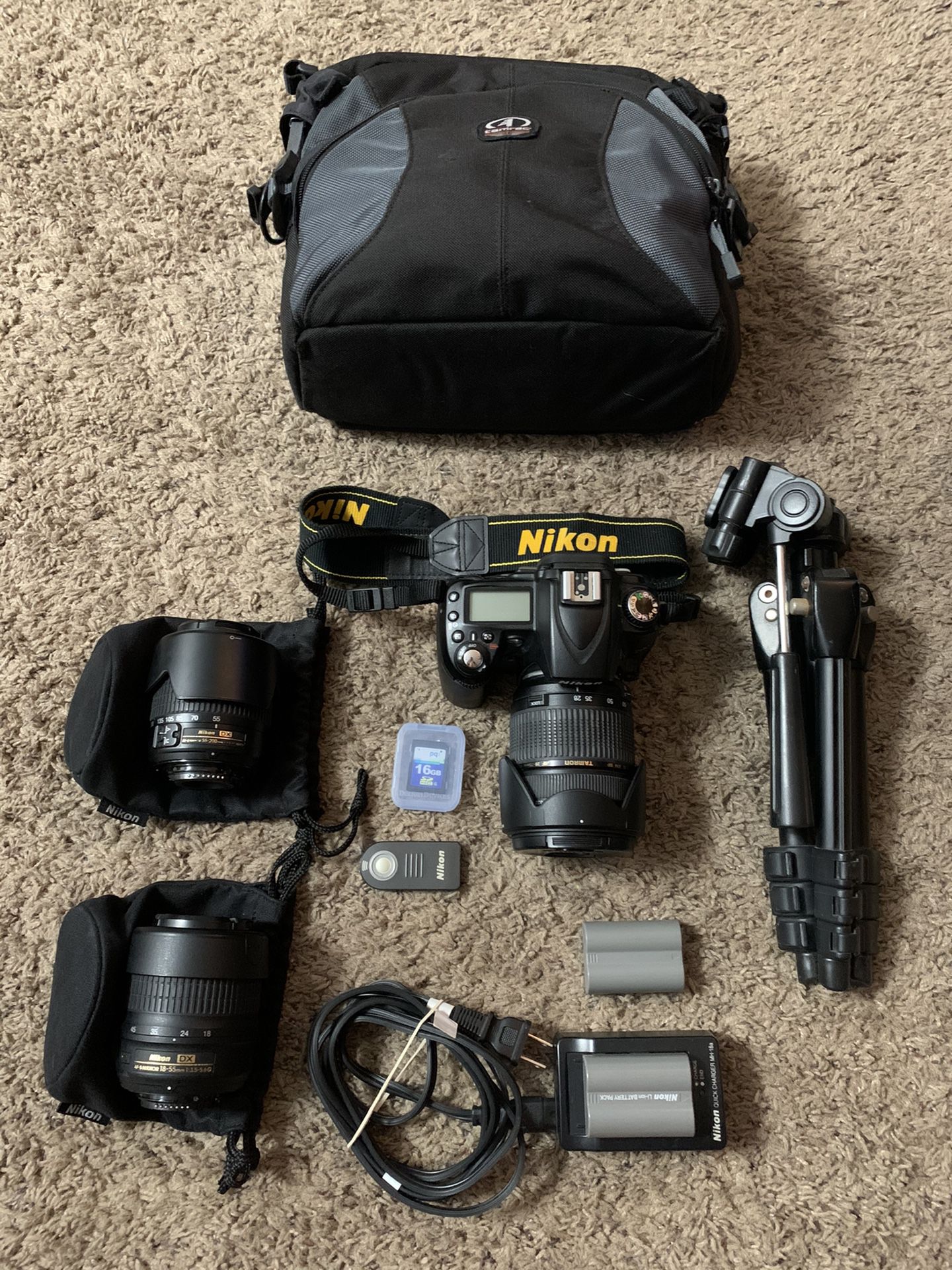 Nikon D90 DSLR Camera with (2) lenses, extra battery, tripod, camera bag and more