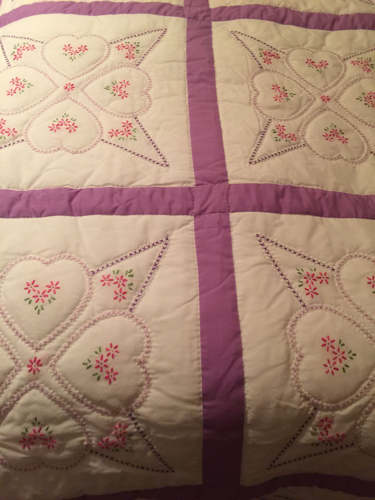Homemade queen size quilt with two hands pillows