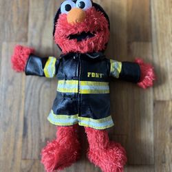 Elmo’s Vintage 2009  15” tall F ire Fighter