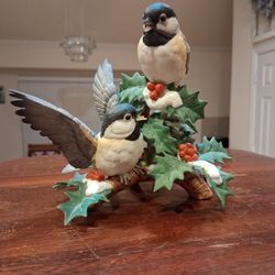 Lennox porcelain figurine of two chickadees on a holly branch.