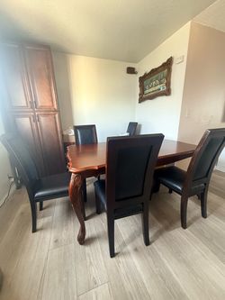 Solid wood dining table and 8 chairs