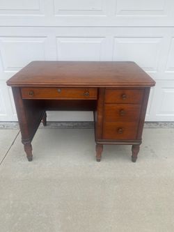 Selling a vintage wooden desk still in solid condition