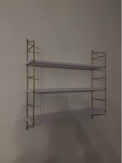 White & gold modern shelf