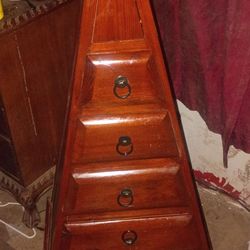 Pyramid dresser dark wood .