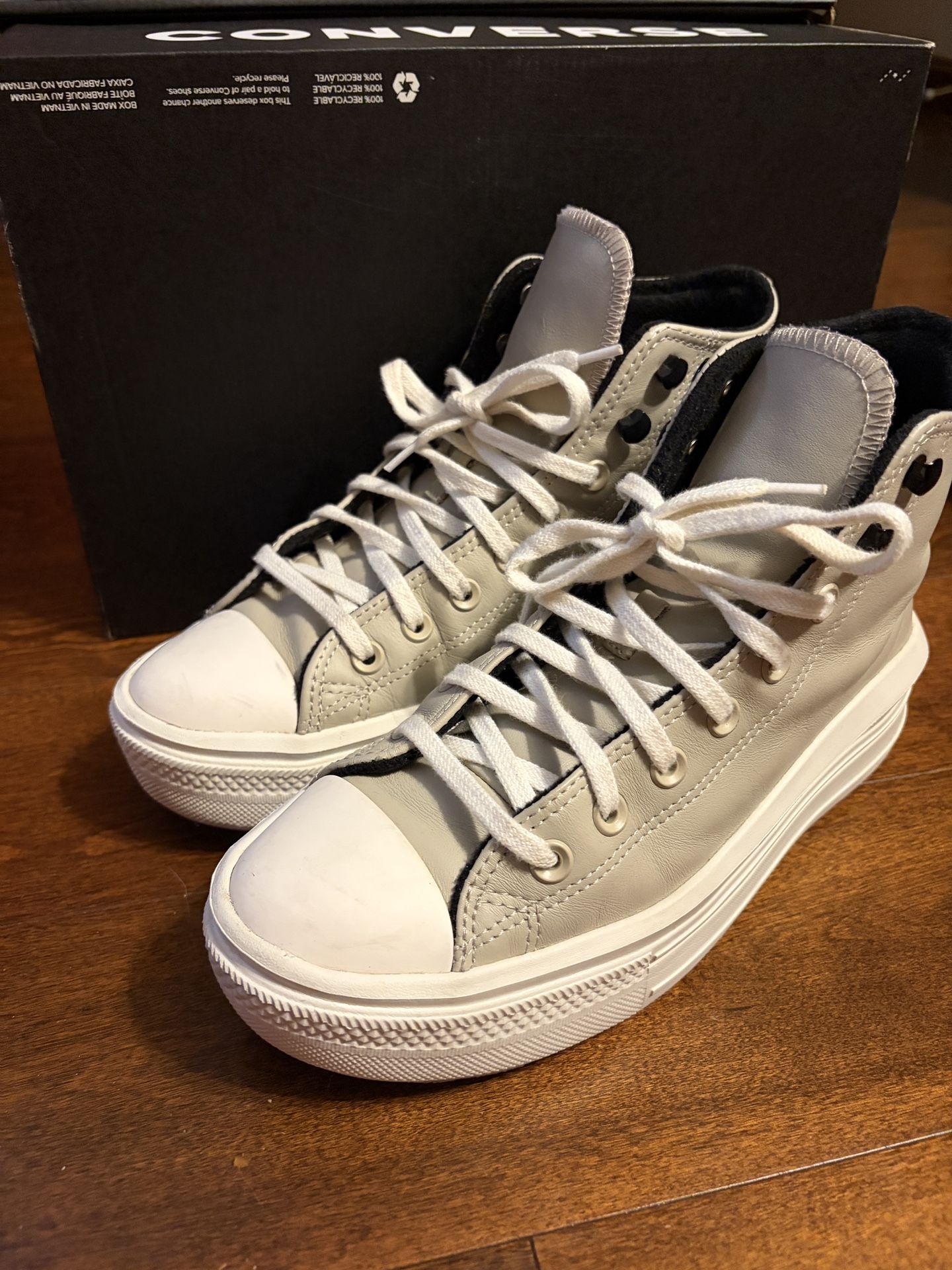 Grey and White High top platform Converse.