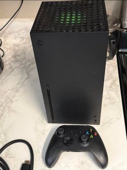 Xbox series X with 2 controllers and 1 game
