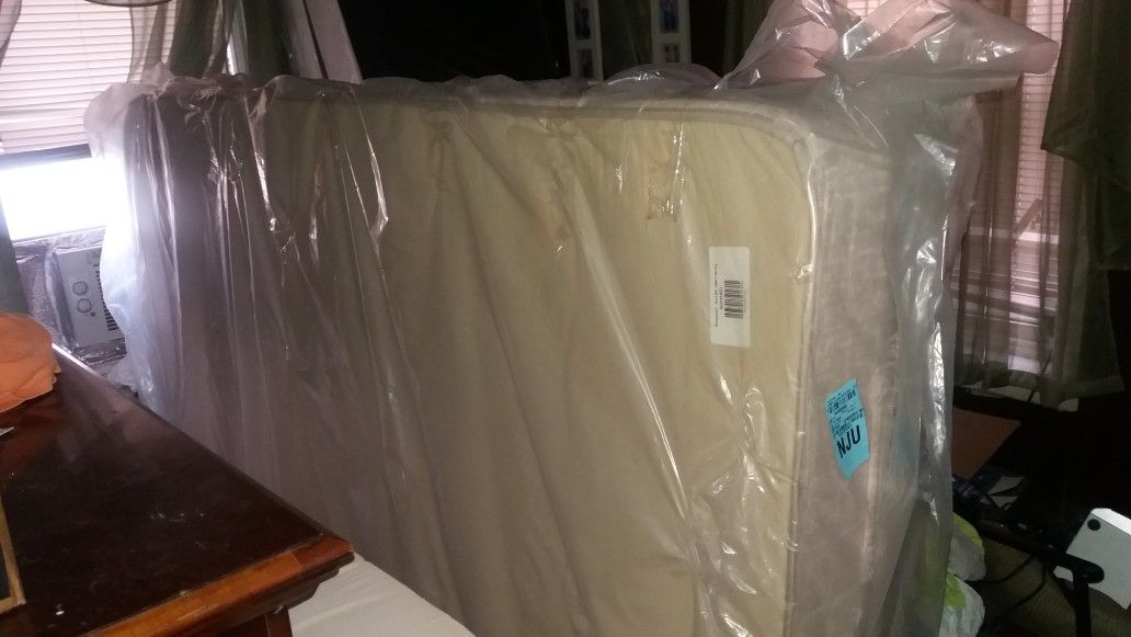 Brand new queen size mattress and split box spring never used