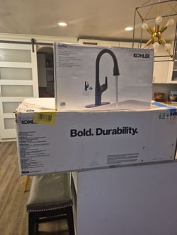 Kohler  white farm sink and black foucet included