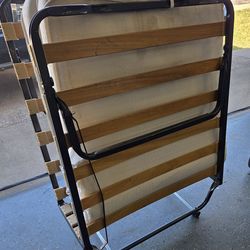 Folding bed with mattress