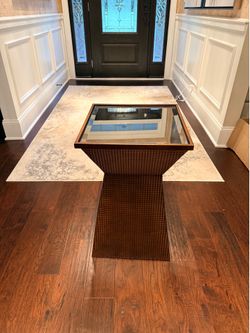 Slightly used copper end table with a glass top