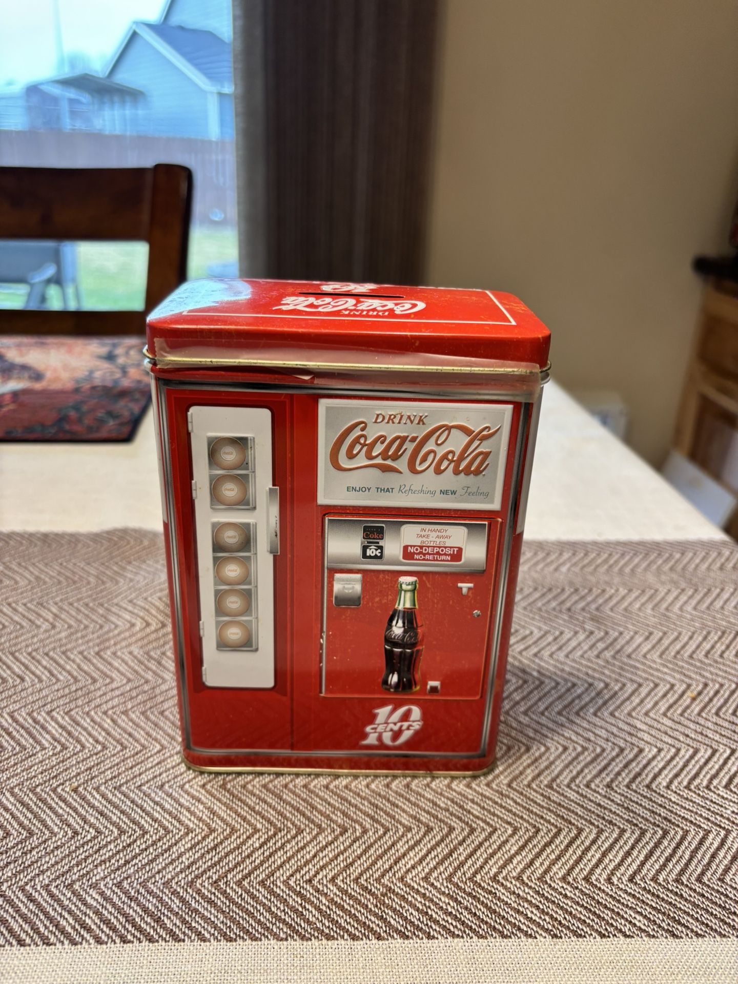 Vintage Coca-Cola vending machine tin