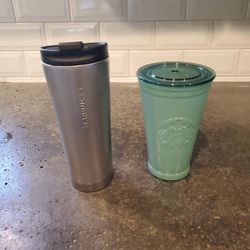 Starbucks 2015 stainless steel "industrial raw" hot to go mug, along with Starbucks 2021 green cold recycled glass cup with lid. 