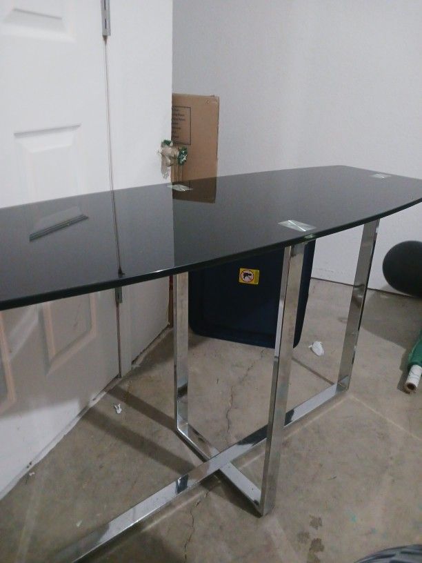 BLACK GLASS N CHROME TABLE..