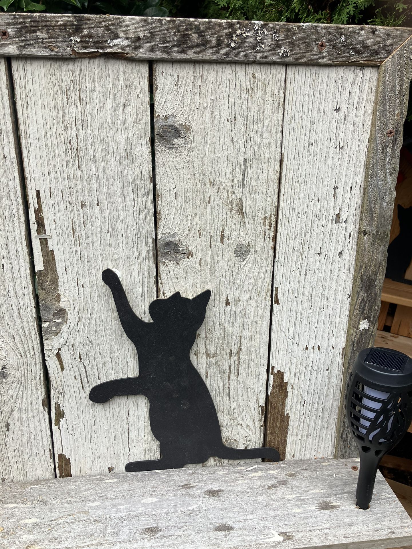 Potting table made of reclaimed cedar with solar lights and cat