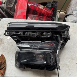 Chevy traverse left headlight Oem