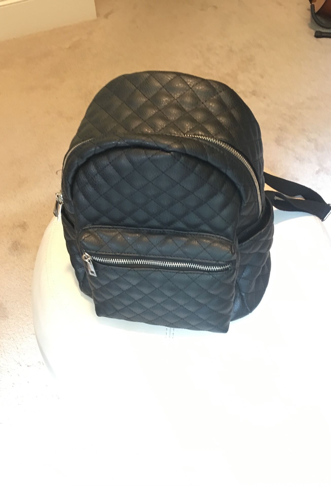 Claire’s black backpack