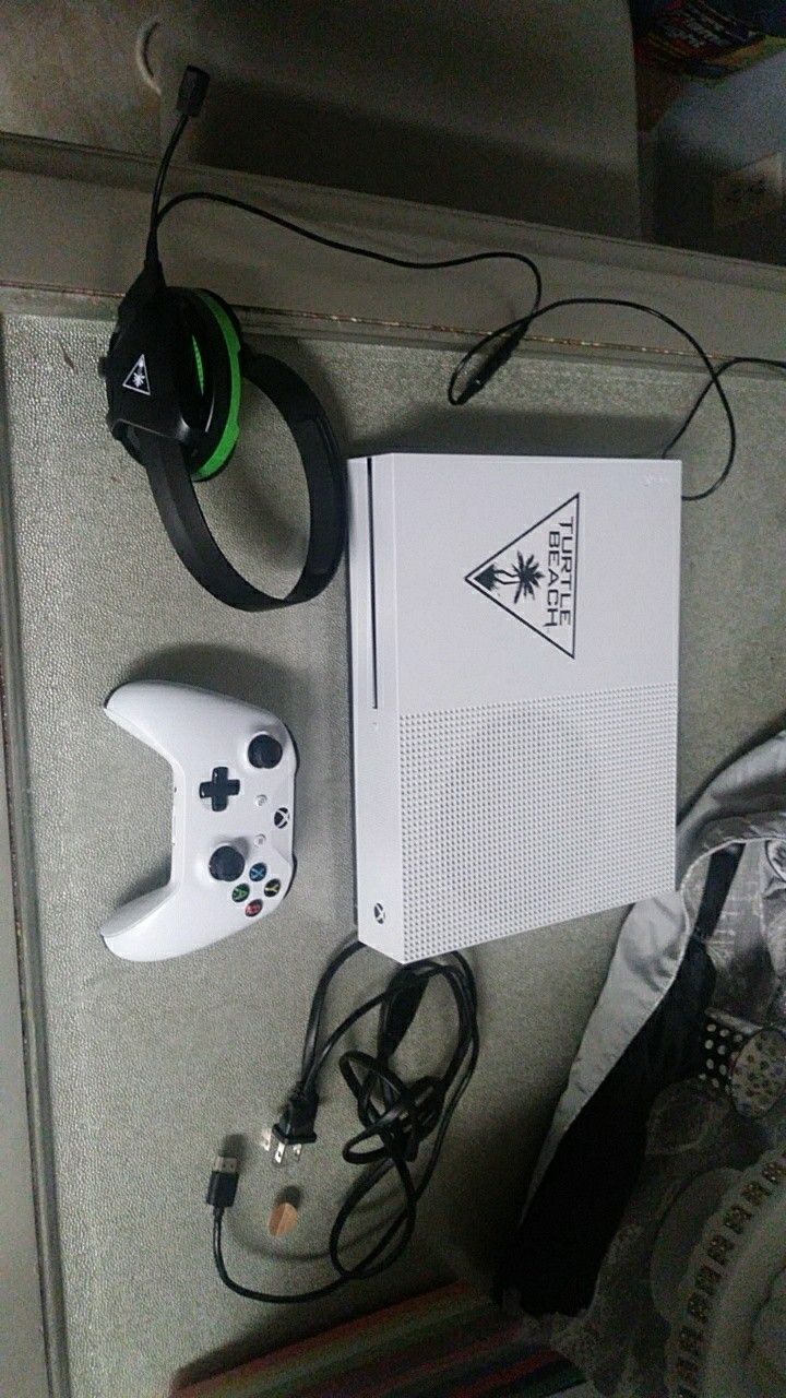 Xbox one s 500GB plus all of the games you see in the picture's
