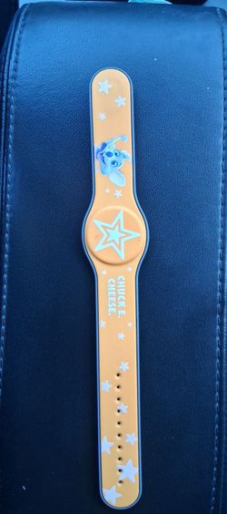 Vintage 2003 Chuck E Cheese Red Rubber Rechargeable Star Wrist Bands Play Band. Great Condition...asking $10.00