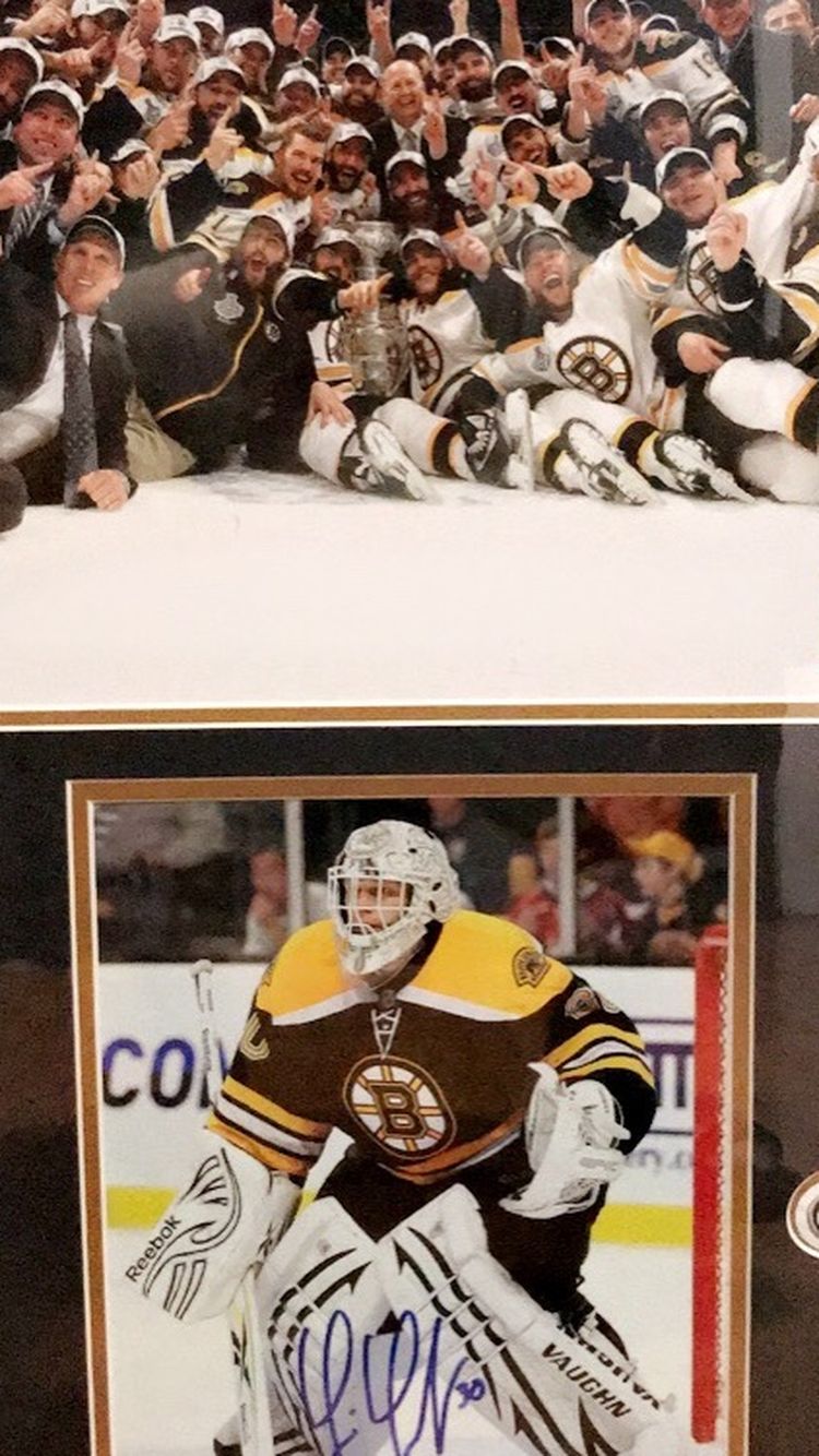 Framed Autographed Picture Signed By Boston Bruins Player Tim Thomas From When They Won The Championship. 26 3/4”x 22 3/4”