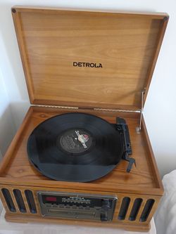 A phonograph AM/FM radio and cassettes office sale with all of these albums