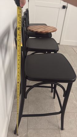 4 black metal chairs