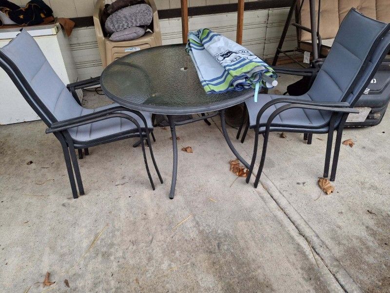  patio table Umbrella  and four chairs