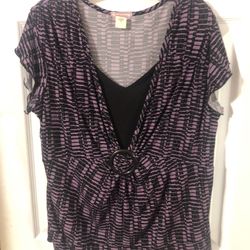 Women’s Size 1X V-Neck CapnSleeve Top. Brand Vol. 1 Woman. Color Black and Purple. Made of 94% Polyester and 6% Spandex. Really nice. Brand New.  