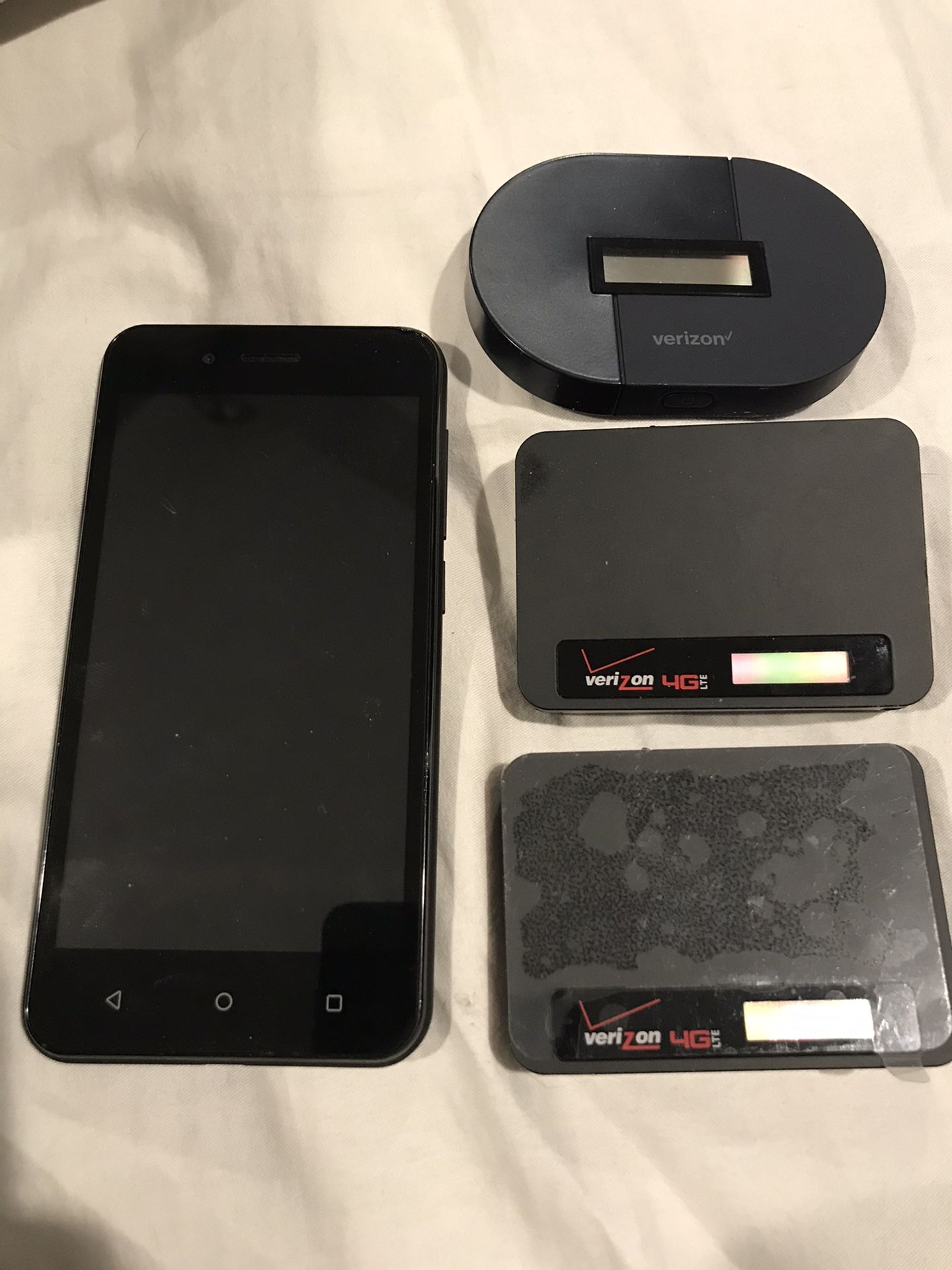 Three Verizon wireless hotspot. And one phone