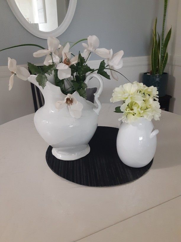 Two beautiful Decorations Pitchers, one is Morocco design on it, the other one is small with two little handles, flowers are included $8 for both
