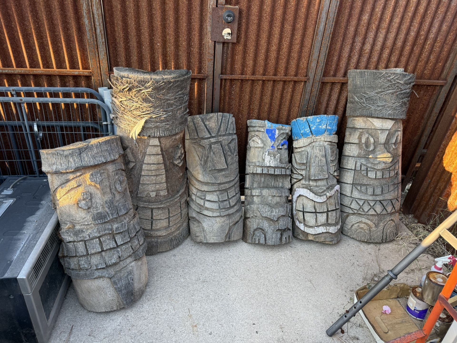 Six Carved Tiki Heads