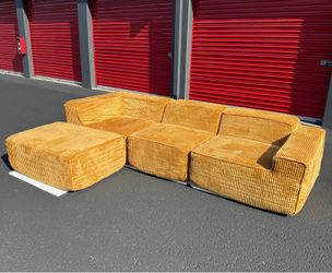 Brand new plush gold sofa and ottoman set