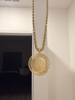 Centenario w/ bezel and 26” 14kt gold plated rope chain.