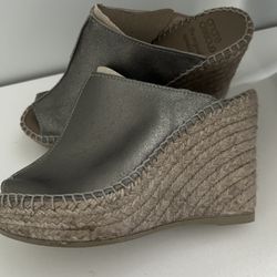 Cici in Pewter   Metallic leather upper Slip on Almond shaped peep toe Leather insole Rubber sole Made in Spain Measurements: Heel height:  4" Platfor