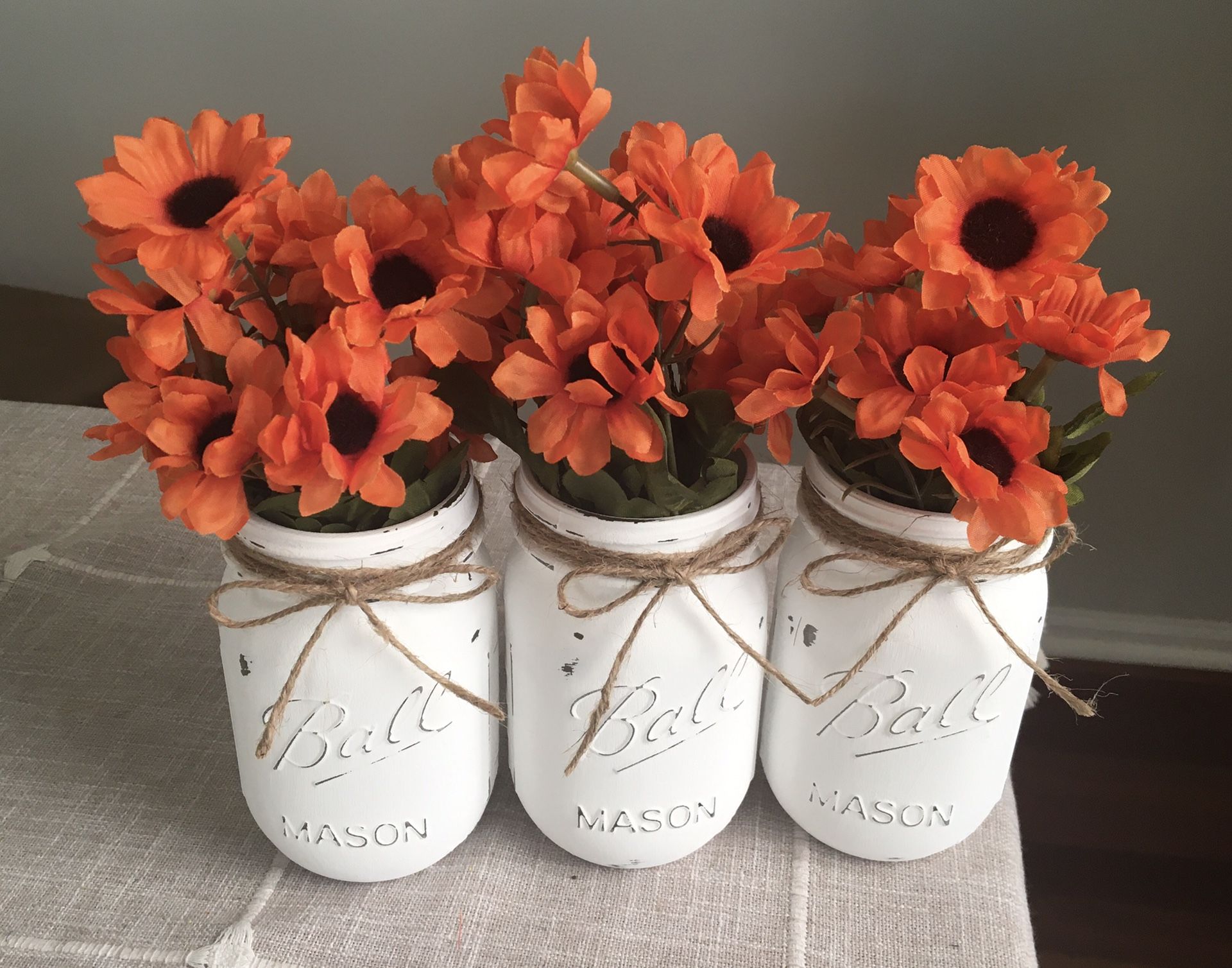 Distressed mason jar vases with flowers included!! Jar/flower choices shown in photos $13 for 3