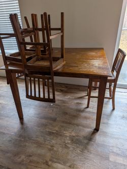 Solid wood pub style table with leaf and six chairs