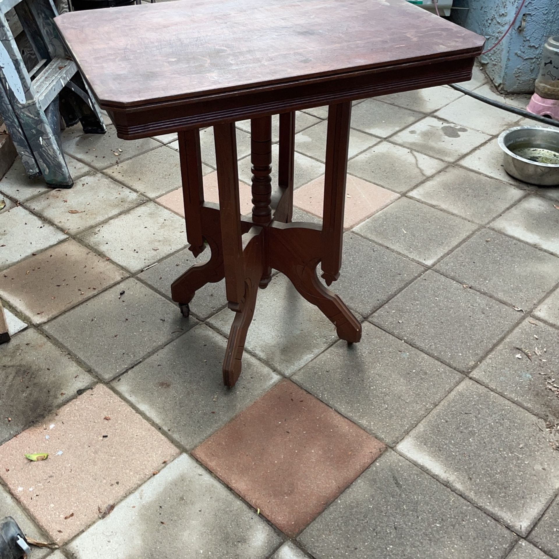 Antique Eastlake Parler Table With Wheels