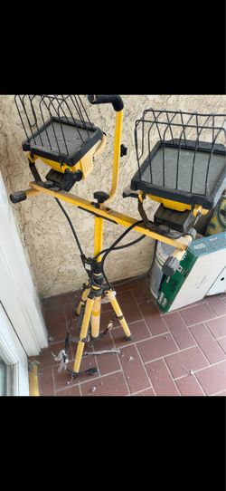 dual-head halogen work light on a tripod.