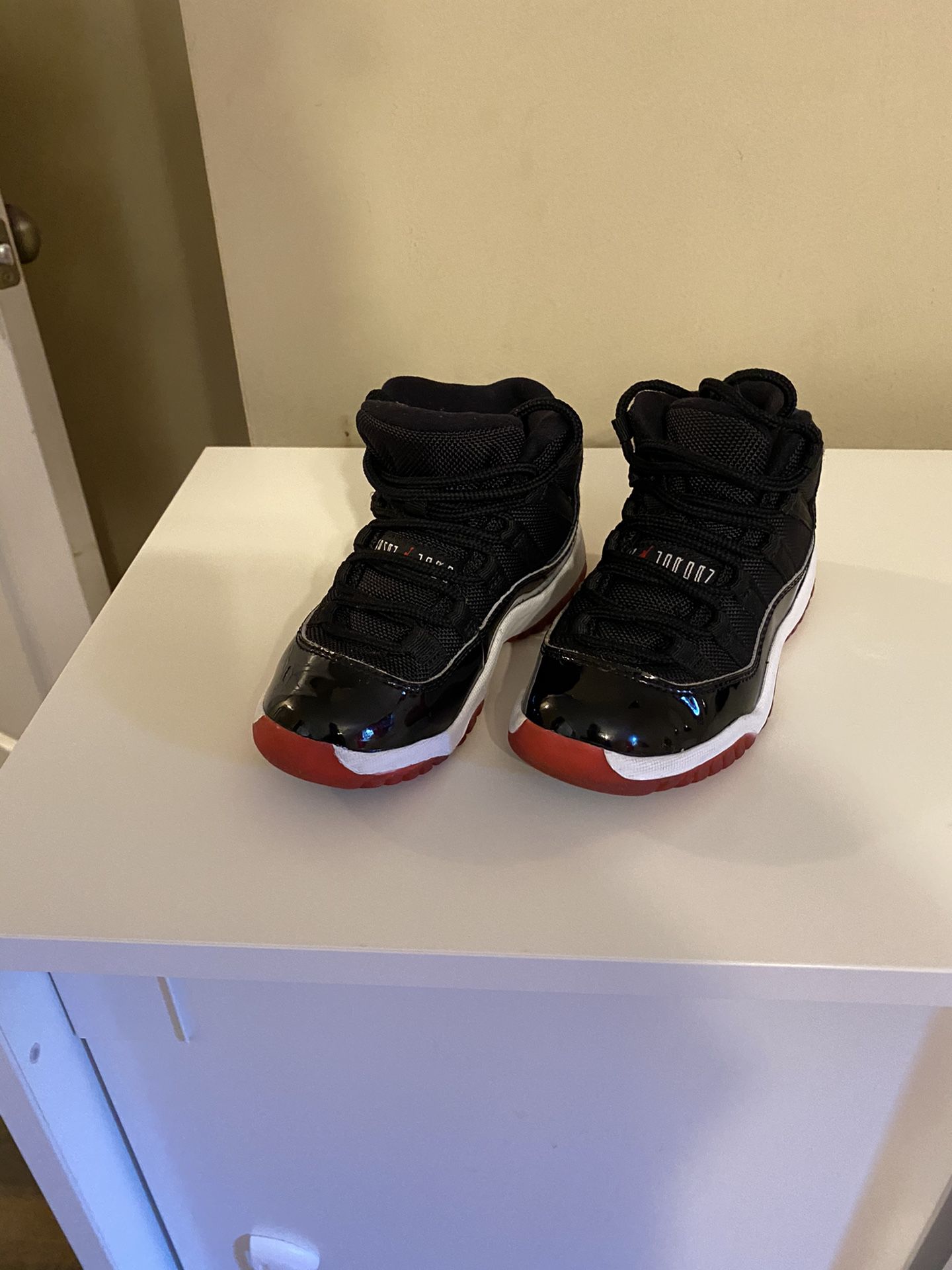 Black and Red kids air Jordan’s size 11c