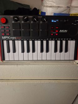 This is an Akai Professional MPK Mini Play MK3 keyboard controller, recognizable by its compact layout featuring 25 keys, MPC-style pads, and control 